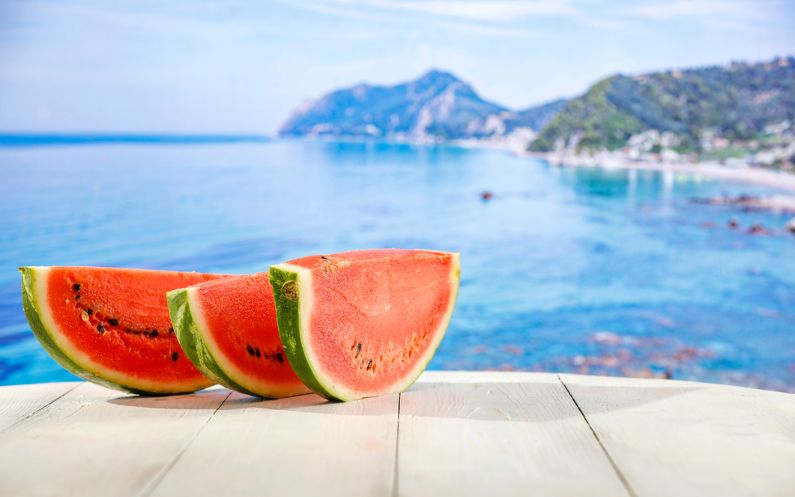 watermelons on a table overlooking a greek summers day